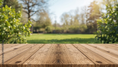 Wallpaper Mural Outdoor spring setting featuring fresh green leaves and a vacant wooden table, suitable for editorial backgrounds Torontodigital.ca