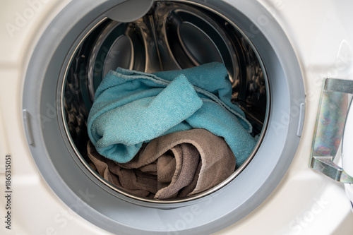 Towels and cloths inside a washing machine drum