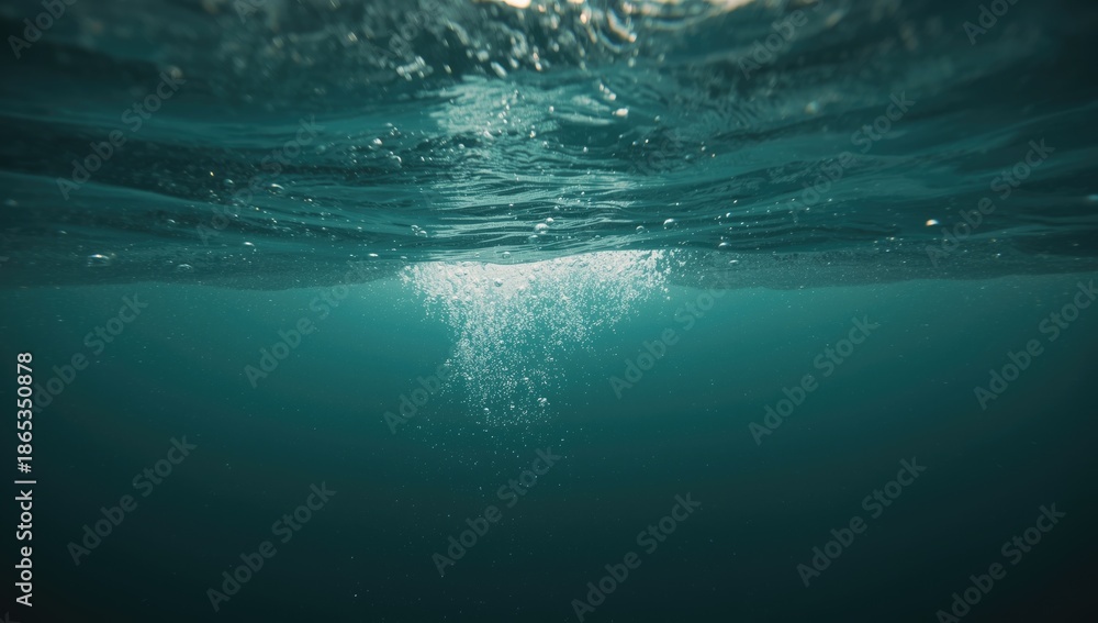 Obraz premium Underwater scene with ascending bubbles in clear green water, ideal for background design or layout.