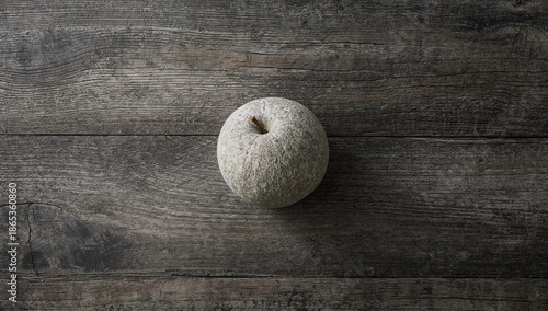 Stone apple placed on rusti...