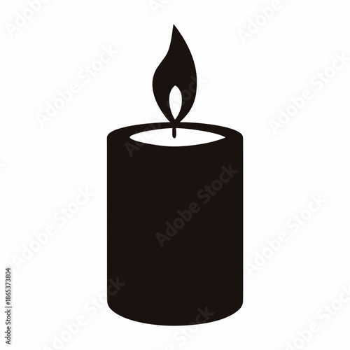 Silhouette of a flickering candle creating soft and warm ambiance on table
