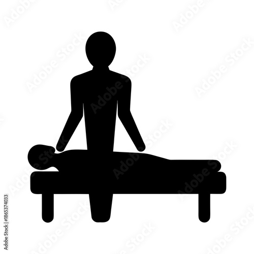 Silhouette of a person getting a massage on a table treatment