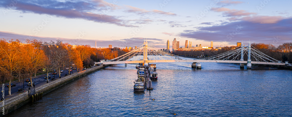 Naklejka premium Albert Bridge panoramic view over River Thames at sunset, Chelsea London UK