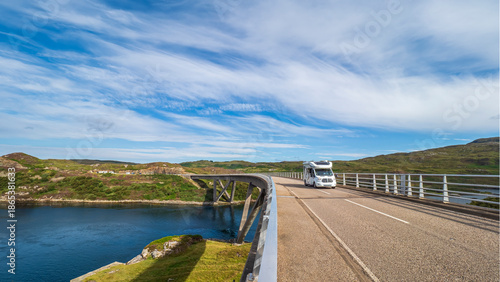 Campervan traveling Kylesku Bridge along North Coast 500 route