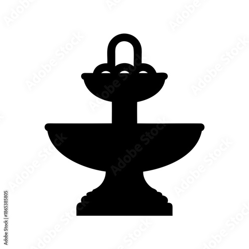 Silhouette of a two tier garden fountain with ornamental detail isolated