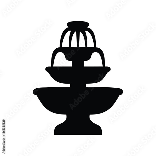 Silhouette of a tiered water fountain against a plain white background
