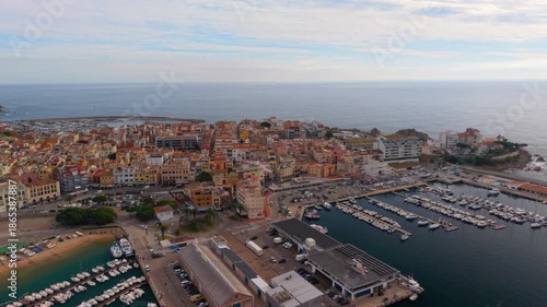 Drone aerial view of palamos harbour and city, costa brava, spain