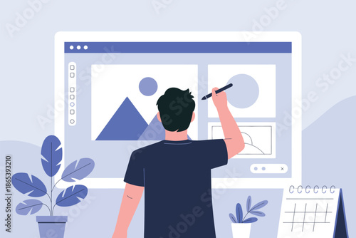 A man in a dark blue shirt is working on a computer with a graphic design program open on the screen.