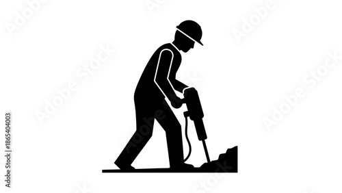 Construction worker drilling into the ground with a jackhammer.