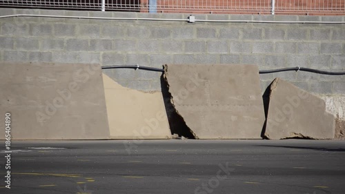 Extreme Motorcycle Stunt Rider Performing Wheelies on Track