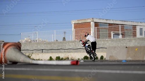 Professional Motorcycle Stunt Rider Practicing on Racing Track