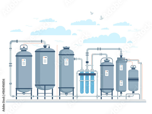 An industrial water filtration system with multiple tanks and pipes under a clear sky with clouds