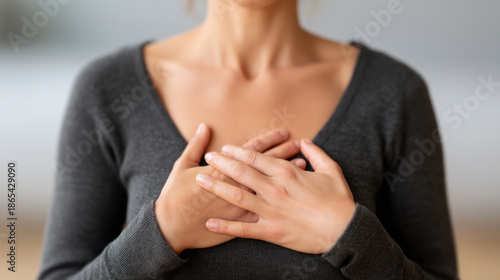 Mindful deep breathing exercise with hands on chest for relaxation and calmness