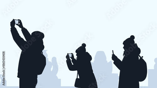 Silhouettes of people taking photos with their phones.