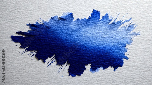 Blue watercolor brushstroke on textured white paper