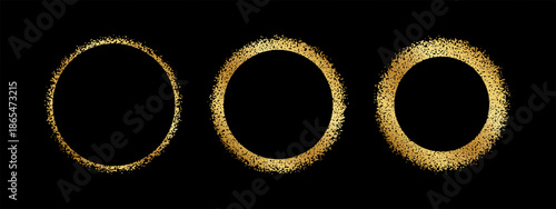 Set of golden round frames with grainy texture. Gold circular shapes with glitter, scatter or mezzotint effect borders isolated on black background. Solar eclipse silhouettes. Vector illustration.