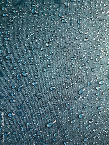 Wallpaper Mural Water droplets on blue waterproof fabric texture background, hydrophobic textile technology concept. Blue background Torontodigital.ca