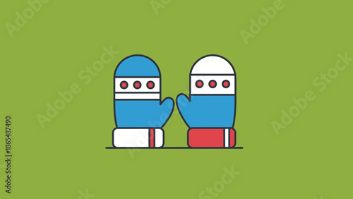 A pair of blue and red winter mittens with white and red stripes and dots, isolated on a green background.