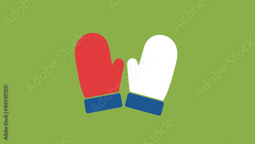 A pair of red and white mittens with blue cuffs are shown against a green background.