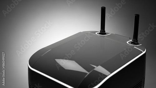 Black wireless router with two antennas on a dark gradient background
