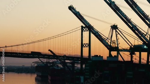Iconic view of the Vincent Thomas Bridge crossing the Los Angeles Harbor at sunset, connecting San Pedro to Terminal Island