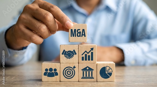 Strategic merger and acquisition concept with businessman stacking wooden blocks showing M&A, growth icons, synergy, corporate finance and investment strategy
