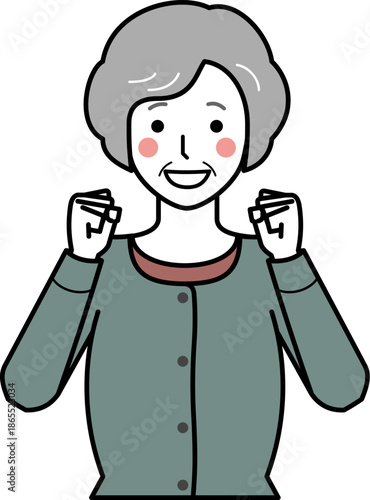 正面向き。ガッツポーズをするカーディガンを着た高齢女性。