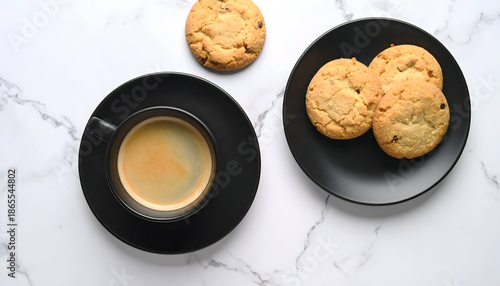 Elegant overhead scene of espresso and homemade cookies on a marble surface, highlighting warm tones and minimalist styling for coffee breaks and relaxed daily moments.