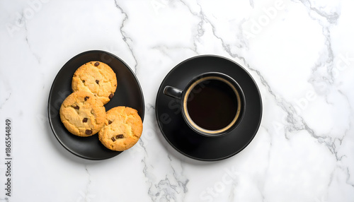 Top view of fresh cookies served with a cup of dark coffee on white marble, styled with balance and simplicity, perfect for breakfast, café branding, or cozy food visuals.