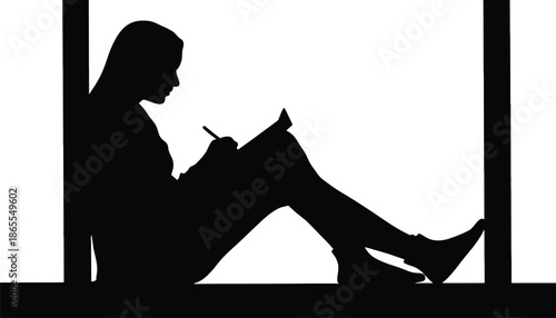 A woman sits in a relaxed position writing in a notebook by the window