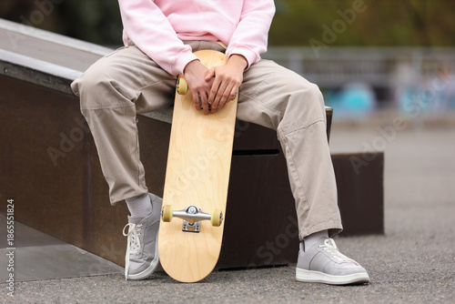 Young man with skateboard s...