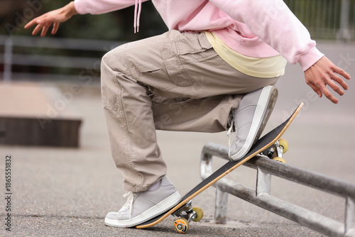 Young man riding skateboard...