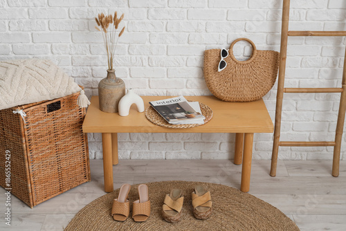 Wooden bench with bag, maga...