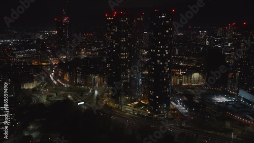 Wallpaper Mural Establishing aerial view of Manchester at night. Illuminated skyline of city in the north of England, United Kingdom Torontodigital.ca