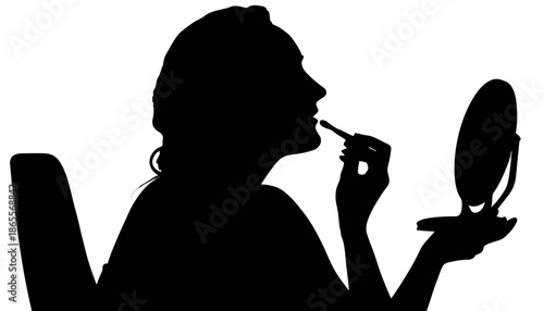 Woman applying lipstick in front of mirror silhouette