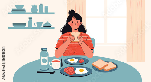 Happy young woman enjoying a healthy and nutritious breakfast of fried eggs and tomatoes with fresh toast and a bottle of milk at her dining table.
