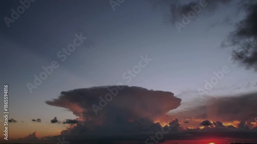 Timelapses. Beautiful 4K timelapse of a dramatic sunset with glowing orange and red clouds, perfect for cinematic projects and nature footage.