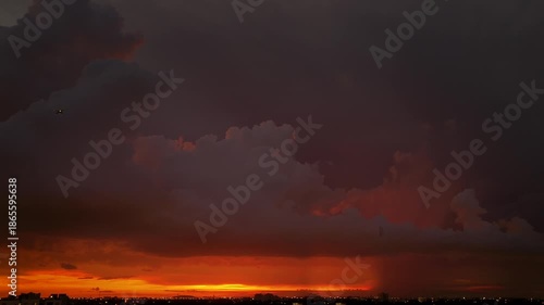 Timelapses. Beautiful 4K timelapse of a dramatic sunset with glowing orange and red clouds, perfect for cinematic projects and nature footage.