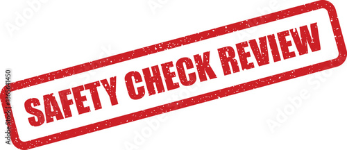 Textured rubber stamp indicating an ongoing safety check review process or a required reevaluation of standards