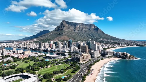 Aerial View of Cape Town Cityscape with Table Mountain and Ocean.