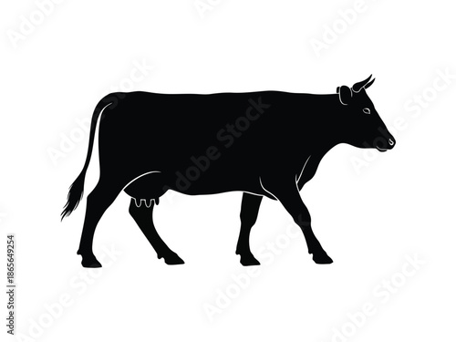 Black silhouette of a cow walking