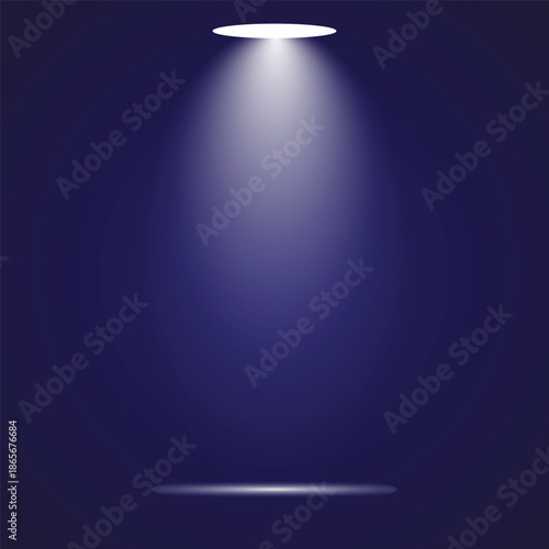 A spotlight shining down on a dark background