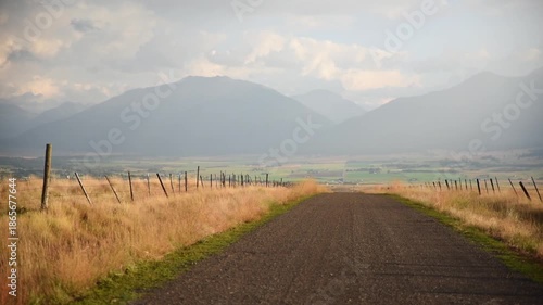 Pan Of Rural Road Through Fields