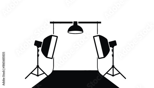 A photography studio setup with lights and backdrop in silhouette mode