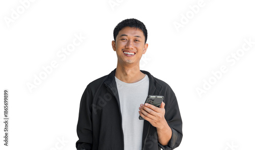 A young man holding a phone is smiling happily, isolated on a white background.