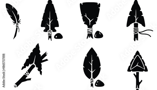 A collection of black silhouettes of ancient arrowheads on transparent background