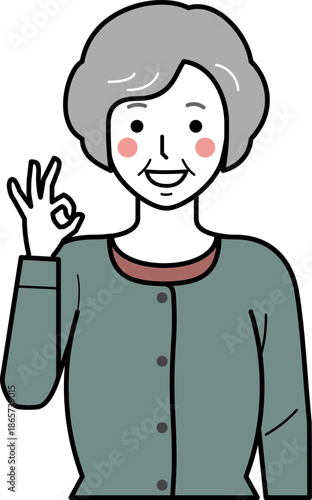 正面向き。OKサインをするカーディガンを着た高齢女性。