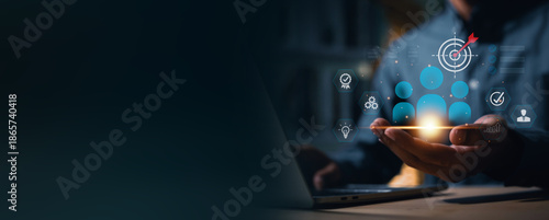 Canvas-taulu Businessman use a laptop to target and select key personnel using digital technology
