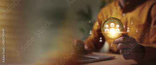Businessman  selecting and defining the target audience or human resources using digital technology. The glowing scope focuses on a group of people, symbolizing precision in marketing strategy, HR man