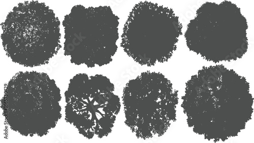 Eight dark grey silhouettes of trees viewed from directly above on a white background overhead canopy